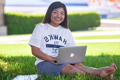 Student sitting with laptop